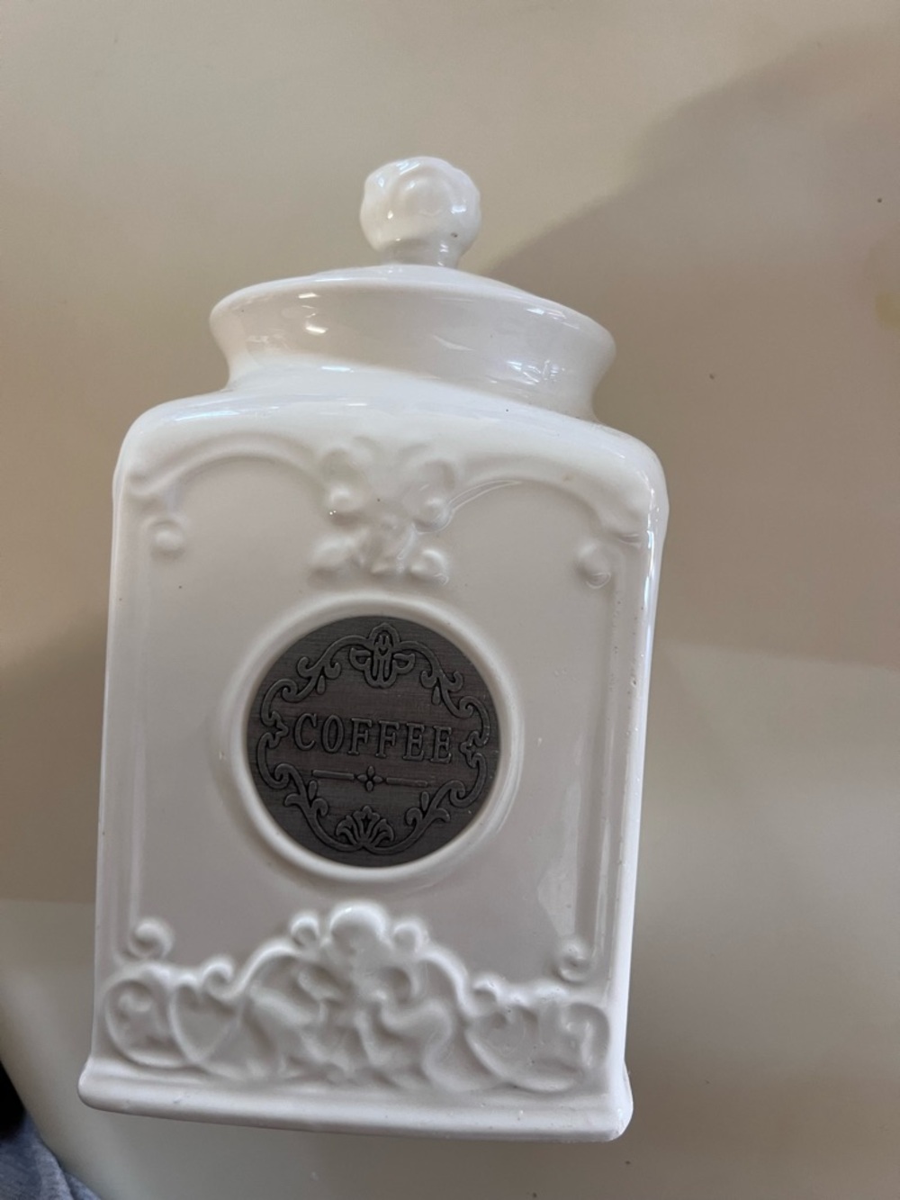 White Ceramic Coffee Canister with Decorative Medallion